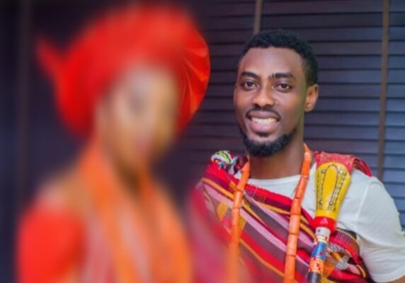 Putsammy and his bride with money at their traditional wedding
