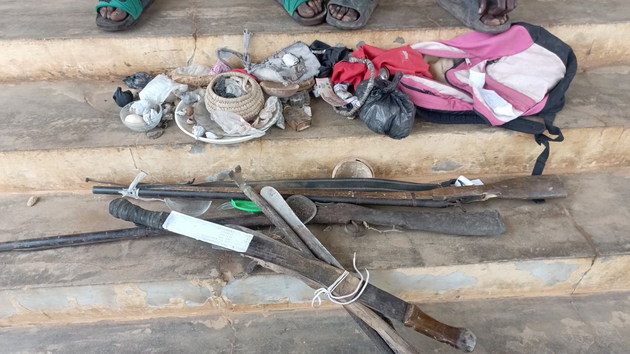 suspects charms, axes, gun