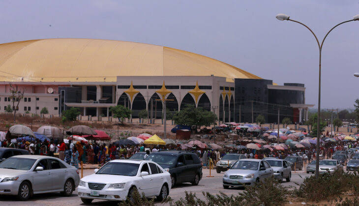 A church building with members trooping in