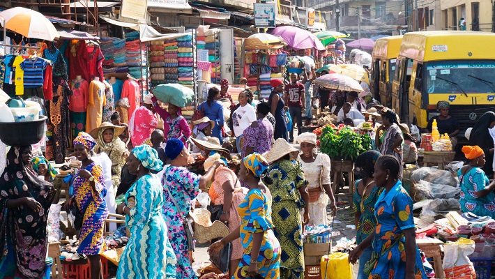 Nigerians in the market going about their daily activities used to illustrate the story. [CREDIT: [Premium Times]