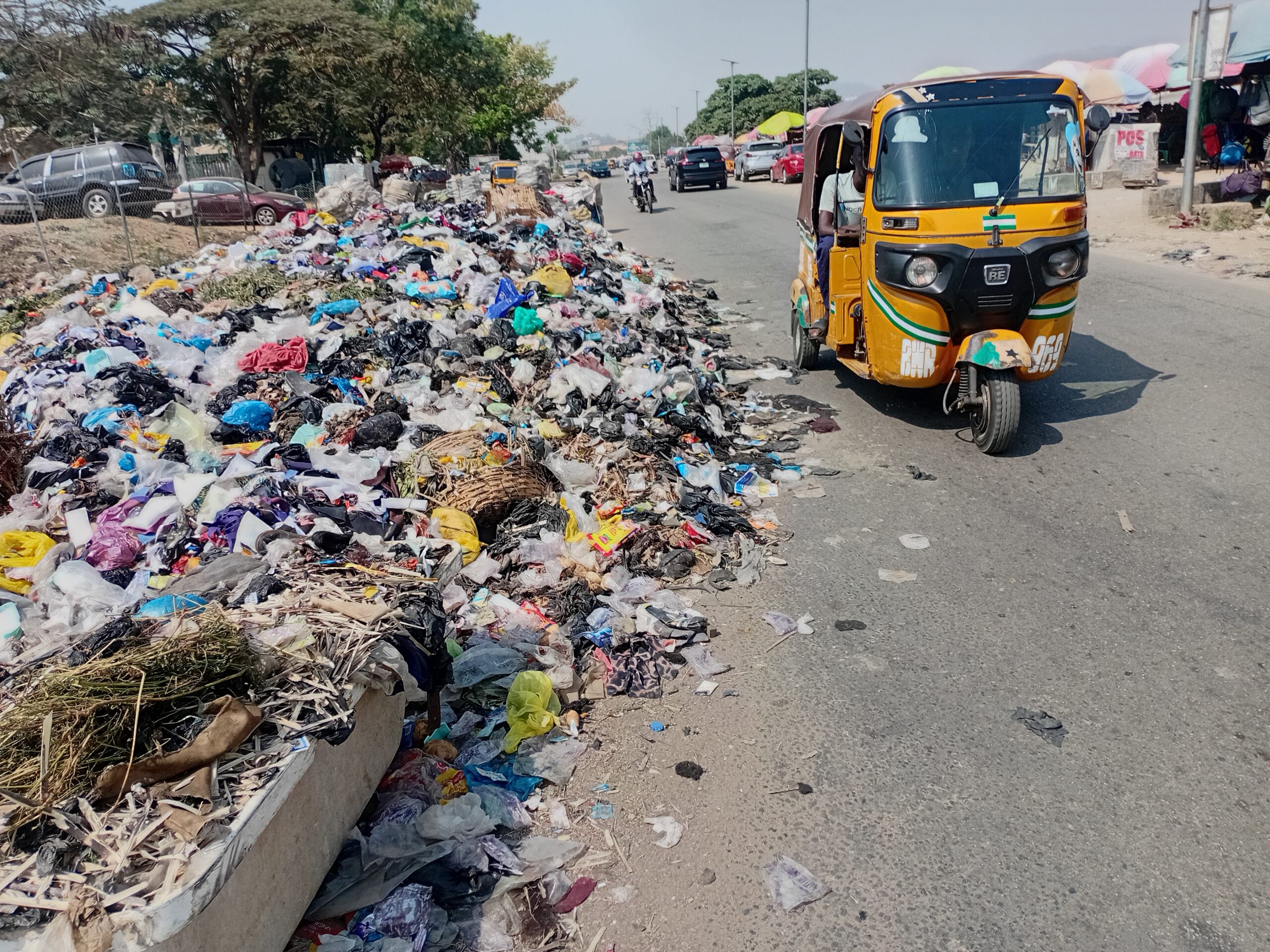 Waste covering some part of the road at Gwarimpa (Credit: Ahmed Oluwasanjo/Peoples Gazette)
