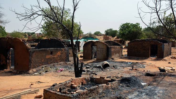 Burnt village in Sudan used to illustrate the story