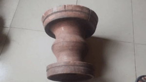 wooden stool Used to hit her grand mother