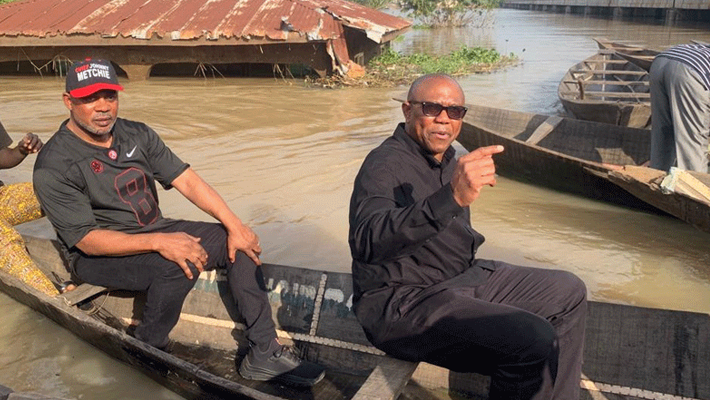 Peter Obi in a flooded Niger community