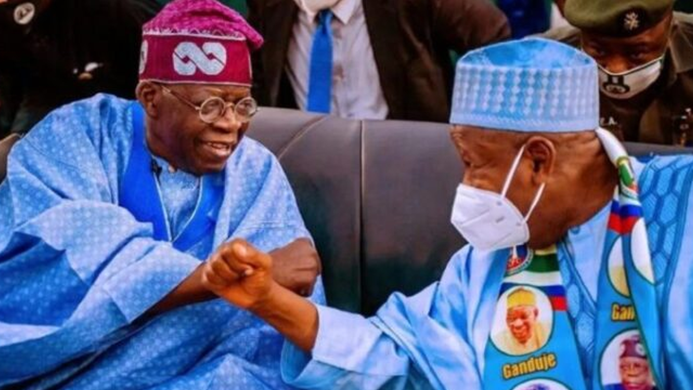 Tinubu sitting with Ganduje