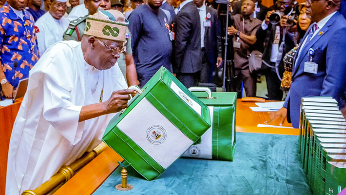 Tinubu carrying budget box