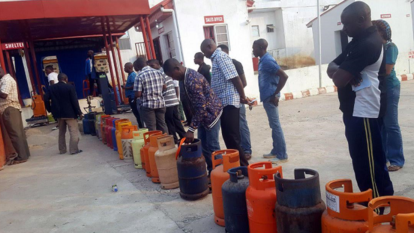 Customers at station with gas cylinders