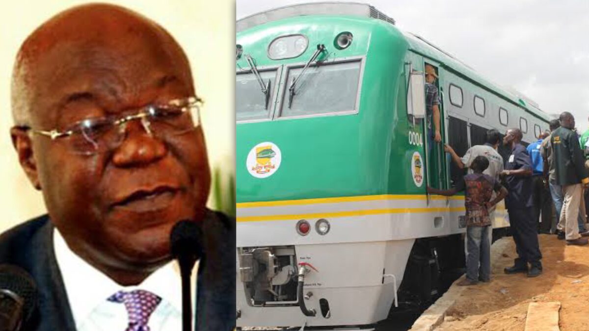 Fidet Okhiria and passengers boarding a train