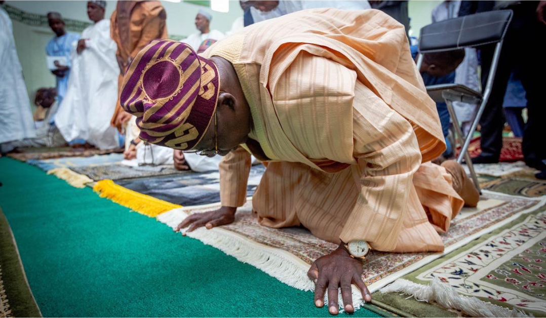 Bola Tinubu praying