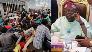 Crowd scrambling for food; Tinubu with toothpick