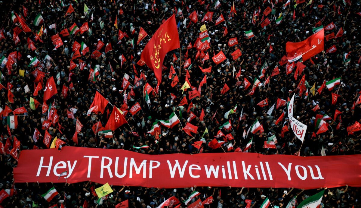 Iranians with banners threatening to kill Trump