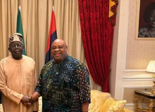 Adeleke shaking hands with Tinubu