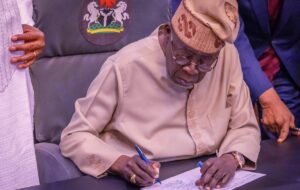 Tinubu signing the electoral bill into law