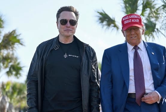 Trump standing with Musk