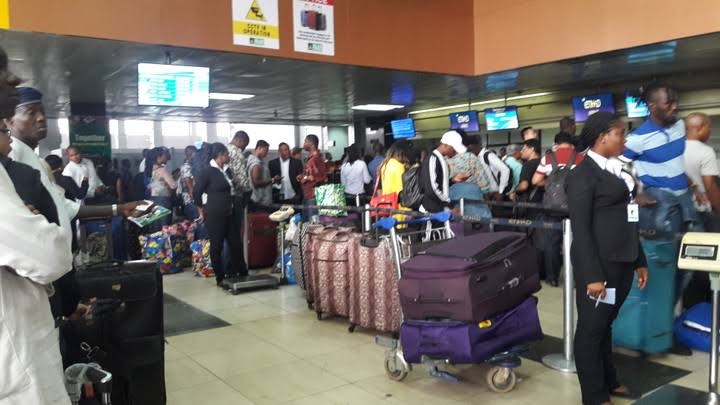 Nigerians travellers with big bags at airport