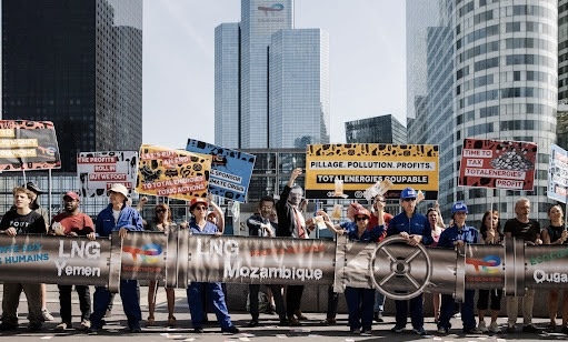 Protest organized by Attac, Avaaz, 350.org, and Action Justice Climat Paris at La Défense Plaza on May 29.