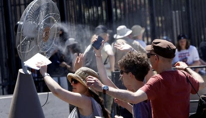 People cooling themselves amid heatwave