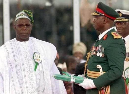 Photo: Abubakar handing over to Obasanjo on May 29, 1999