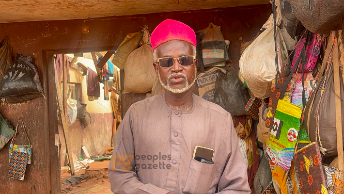 Mr Umar inside his damaged building.