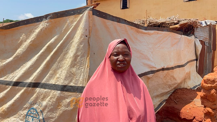 Ms Mukhtar in front of her tent.