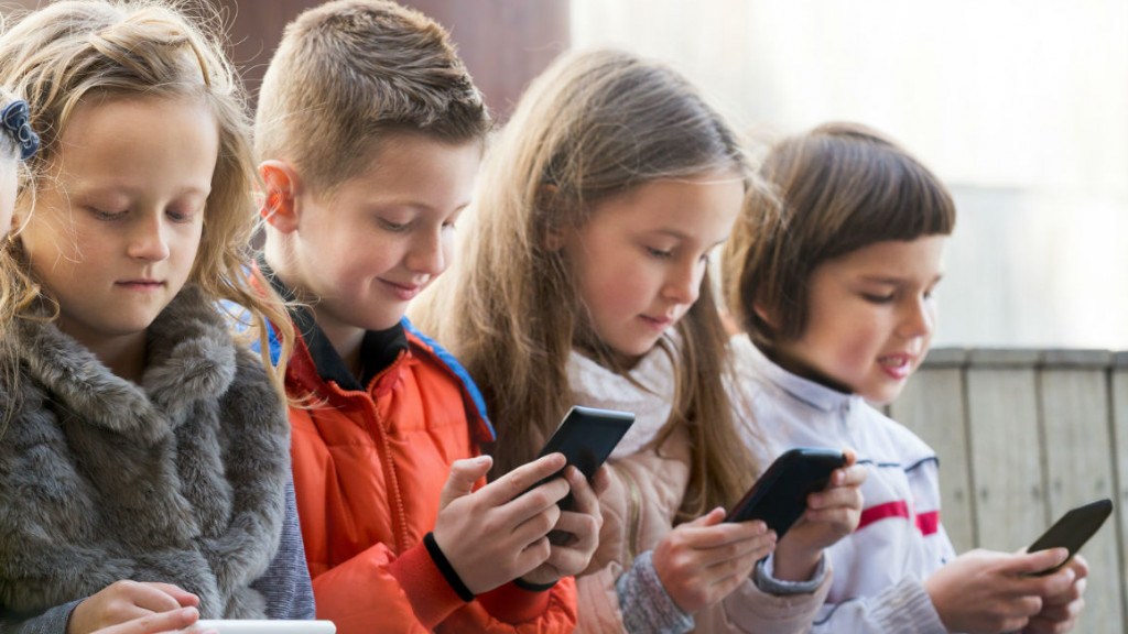 British kids using mobile device