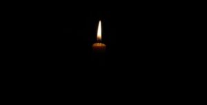 Candle in darkness