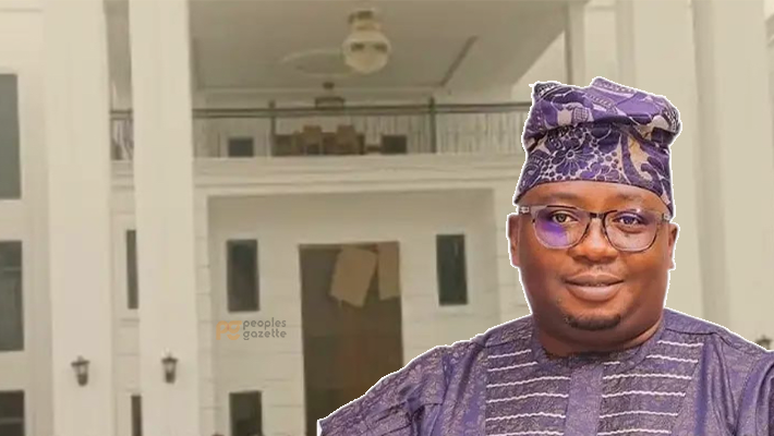 Adebayo Adelabu with his mansion