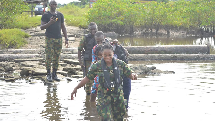 Naval officers in creek during operation