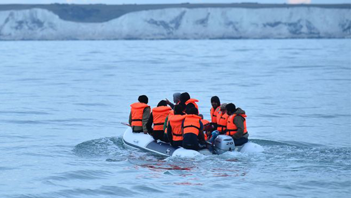People cross the English Channel on boats