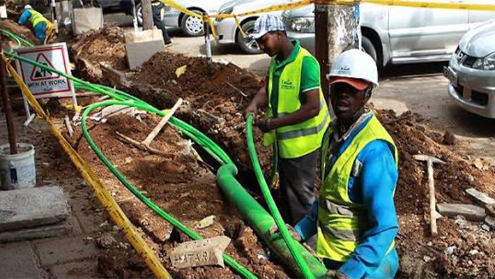 Technicians working on fibre optic cables