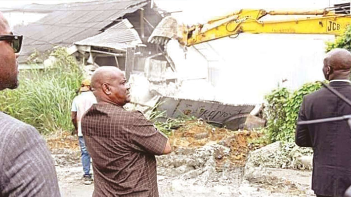 Wike supervising a demolition