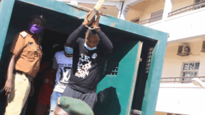 Old photo of Omoyele Sowore in handcuffs