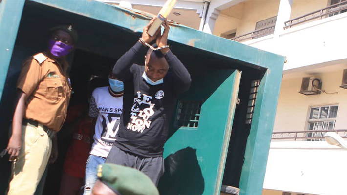 Old photo of Omoyele Sowore in handcuffs