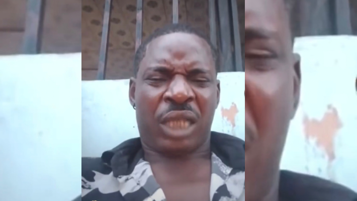 Screenshot of video of police officer threatening to kill anyone who records him