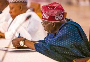 President Bola Ahmed Tinubu signing