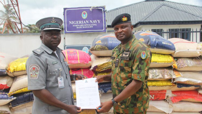Navy hands over seized 97 bags of rice to Nigeria Customs Service