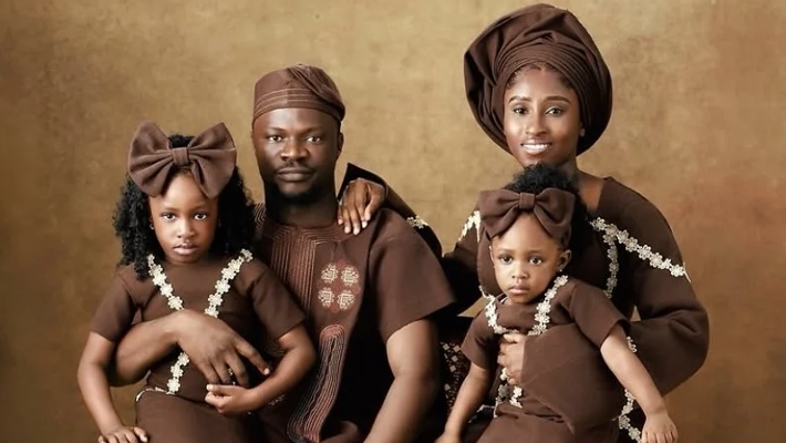 Toluwanisins with his wife and children