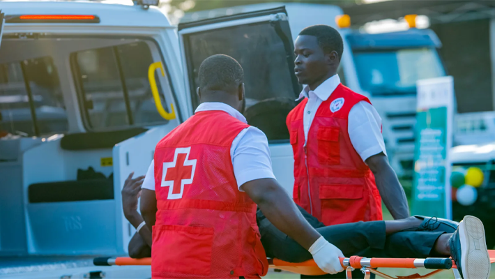 Healthcare workers by an ambulance