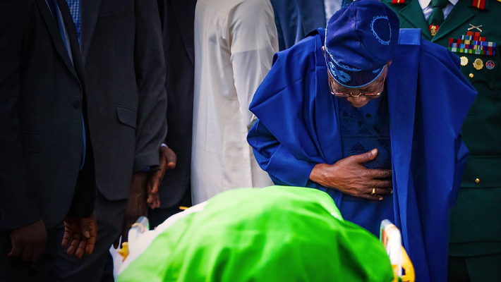 President Bola Tinubu bows to the remains of Muhammadu Buhari