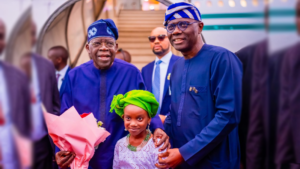 President Bola Tinubu, Babajide Sanwo-Olu and a flower girl