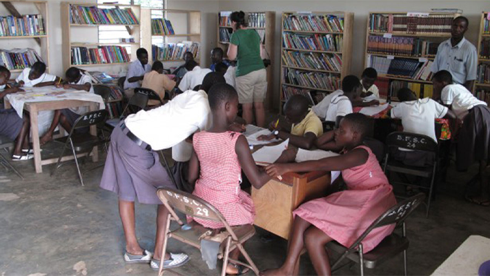 People in a library reading