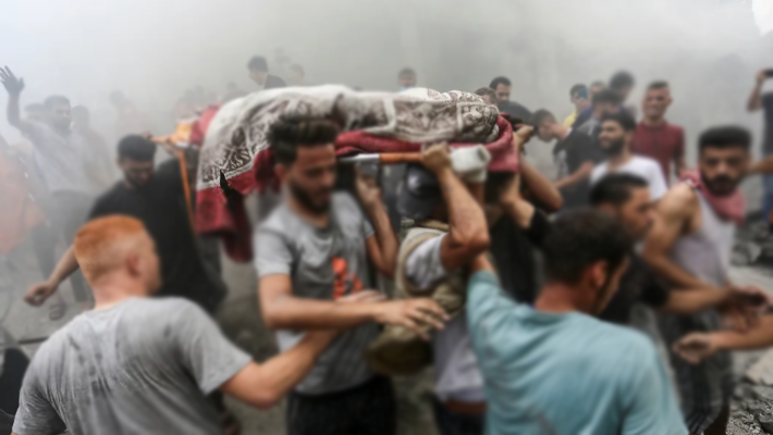 People carrying bodies
