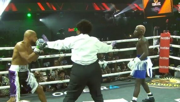 Portable and Okocha during the rematch.