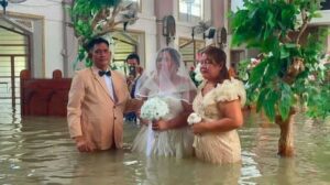 Couple in flooded church getting married