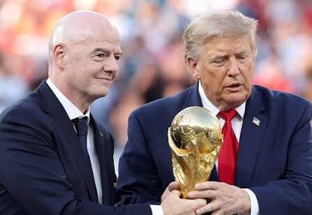 Infantino holding World Cup with Trump