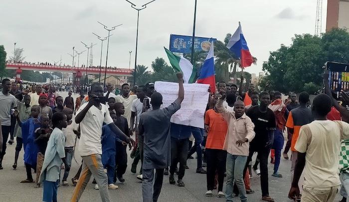 Nigerians protesting with Russian flag