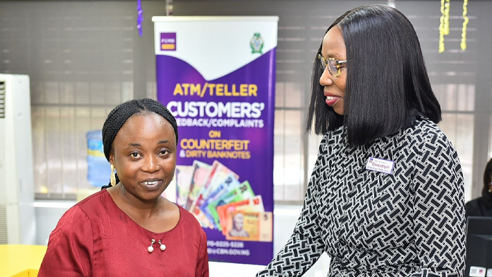 Executive Director, Risk Management, First City Monument Bank (FCMB), Mrs. Oluwatoyin Olaiya, served customers at the bank's McCarthy branch in Lagos. Pictured with Mrs. Olaiya is a customer, Mrs. Oluwaranti Adeniyi.