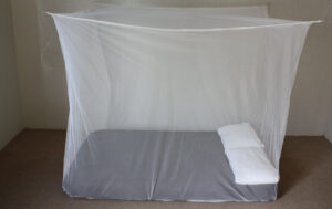Treated mosquito nets