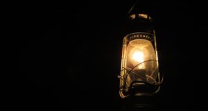 LIT LANTERN IN DARKNESS