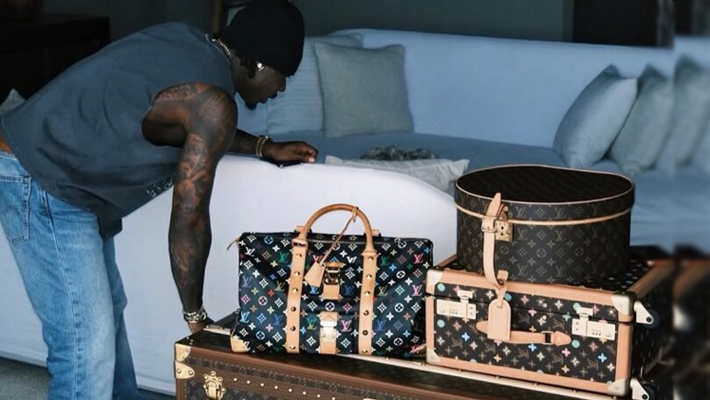 Asake and his Louis Vuitton trunk